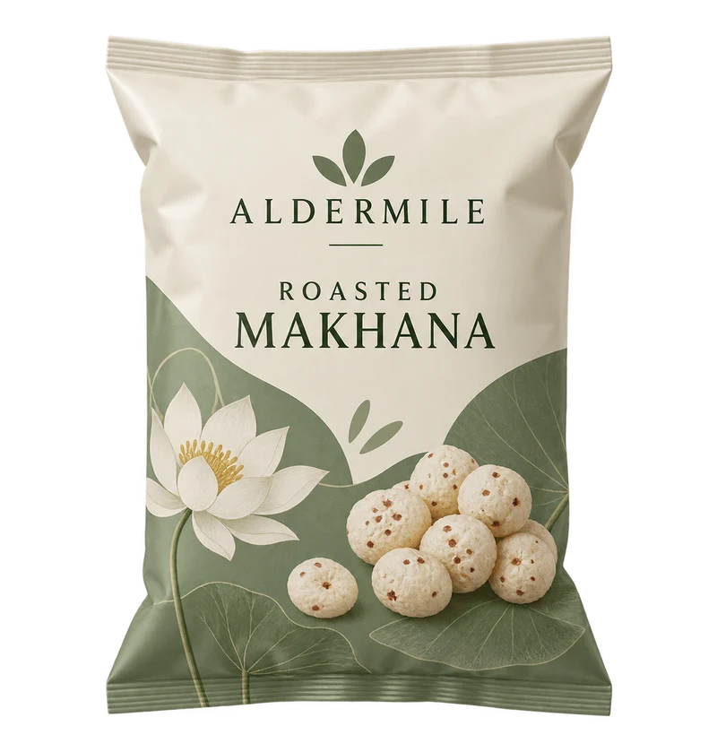 A pillow pouch of puffed lotus seed snacks with cream and dusty sage artwork, small printed puffed lotus seed illustration, with fictional ALDERMILE branding.