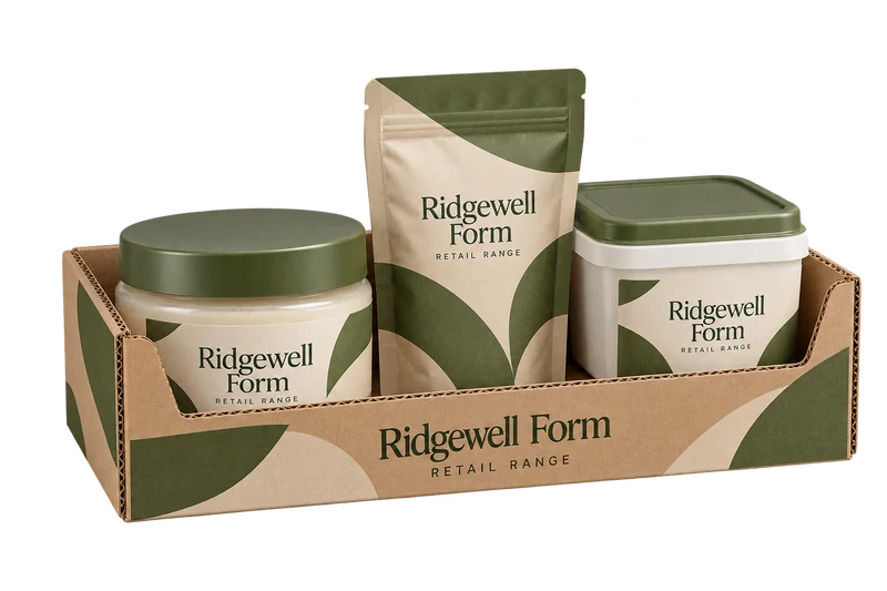 A shelf-ready corrugated tray holding a jar, pouch and square tub with fictional-brand artwork.