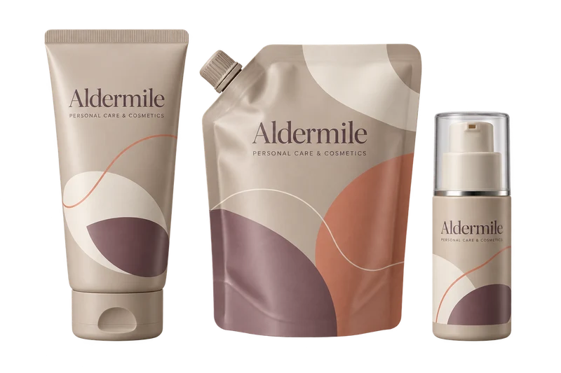 A cosmetic tube, refill pouch and airless bottle with fictional-brand artwork.
